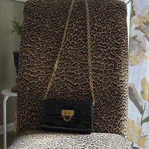 A 7 inches wide times 4.5 inches tall. It’s a Salvatore Ferragamo.